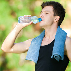 Man drinking water after fitness