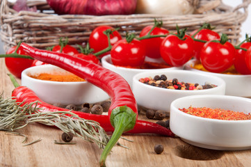 Different spices on a wooden table