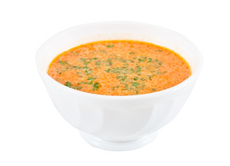 a plate of soup on a white background