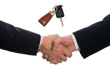 Hands shake after car purchase isolated on white