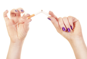 Woman’s hand crushing cigarette