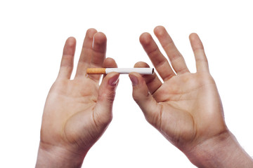 Man's hand crushing cigarette