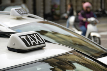 Taxi sign on an urban cab