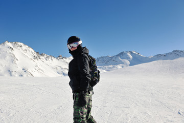 Fototapeta na wymiar skiing on fresh snow at winter season at beautiful sunny day