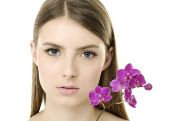 Portrait of woman with pink orchids