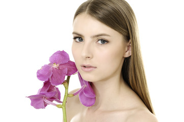 pretty woman with beautiful makeup holding violet orchid
