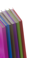 Stack of colorful real books on white