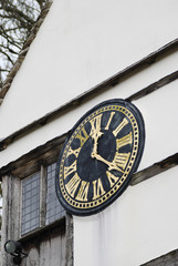 Clockface on coach house wall © nickos