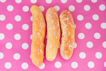 Breads on polka dot pink background
