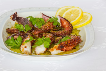 Grilled octopus with olive oil, lemon, oregano and parsley