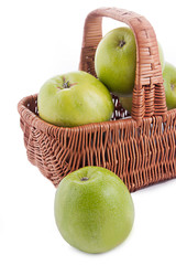 Ripe green apples in basket