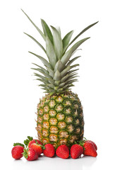 Fototapeta premium Isolated fruits - Pineapple and Strawberries