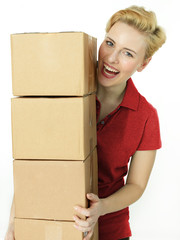 Young woman at work has fun as a parcel service - obrazy, fototapety, plakaty