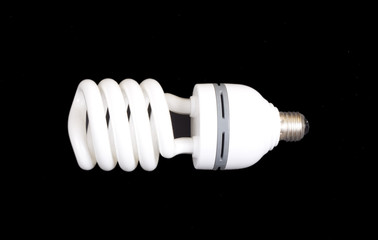 Energy-saving lamp isolated on black bac