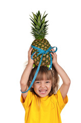 Little girl with pineapple