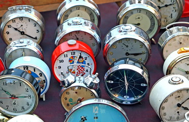 series of ancient clocks and watches from table