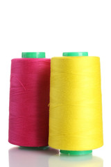 Bobbins of thread isolated on white