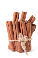 Close-up of cinnamon bundle, isolated over white