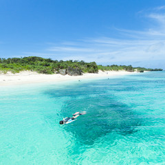 Snorkeling in tropical water of a coral lagoon, Okinawa
