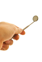 Hand holding mirror dental tool