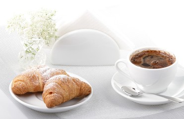 Breakfast with coffee and croissant