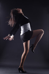 RnB woman dancer against black background