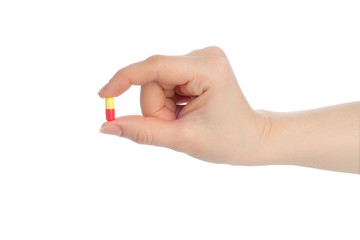 Hand with pill on white background