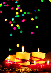 Beautiful candles and decor on wooden table on bright background