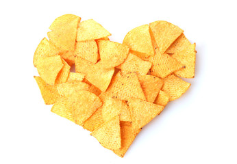 Delicious potato chips heart shape isolated on white