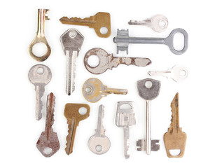 Many metal keys isolated on white