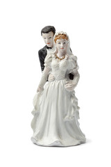 Fototapeta na wymiar Old plaster bride and groom cake topper isolated on white back