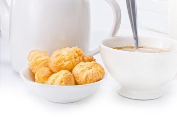 Breakfast with choux pastry and cocoa on clean white