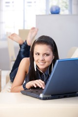 Attractive girl using laptop at home