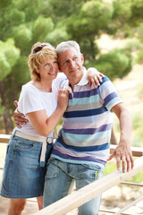 Naklejka premium Mature couple smiling and embracing.