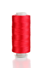 Red bobbin thread isolated on white