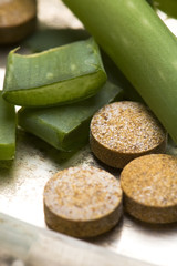 aloe vera plant with pills - herbal medicine