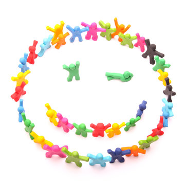 zwinker smiley aus ganz vielen bunten Knetfiguren