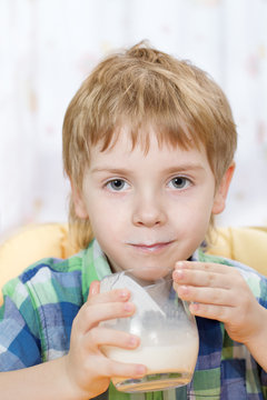 Boy With Milk Mustache After Drinking From Glass