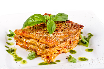 Closeup of lasagna and basil fork
