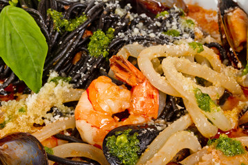 Black tagliatelle (pasta made with cuttlefish ink) with shrumps,