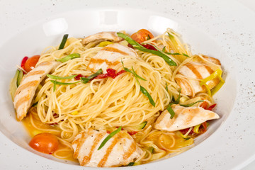 close-up of plate of pasta and chicken