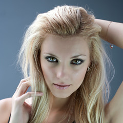 Portrait of caucasian woman blonde closeup on dark background