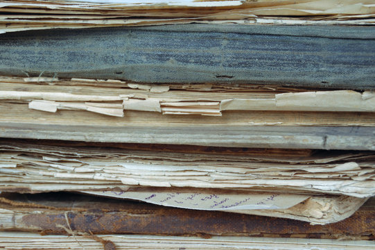 stack of ancient books and documents isolated close-up