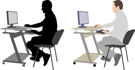 man sitting in front of computer