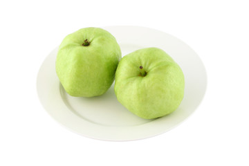 Green guava dish on white background.