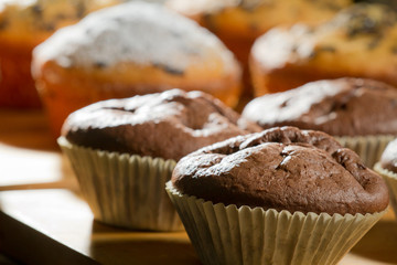 Various muffin on wooden board