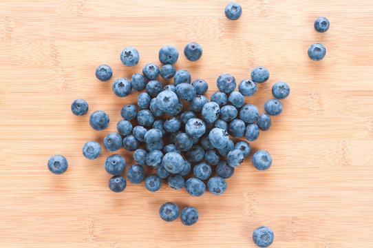 Fresh blue berries group on wooden back