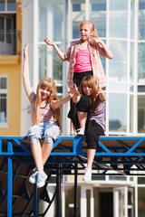 Obraz premium Teenage girls relaxing on a city street