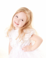 Fototapeta na wymiar lovely little girl wearing white dress