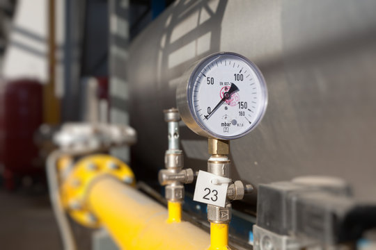 Closeup of a pressure meter on a machine